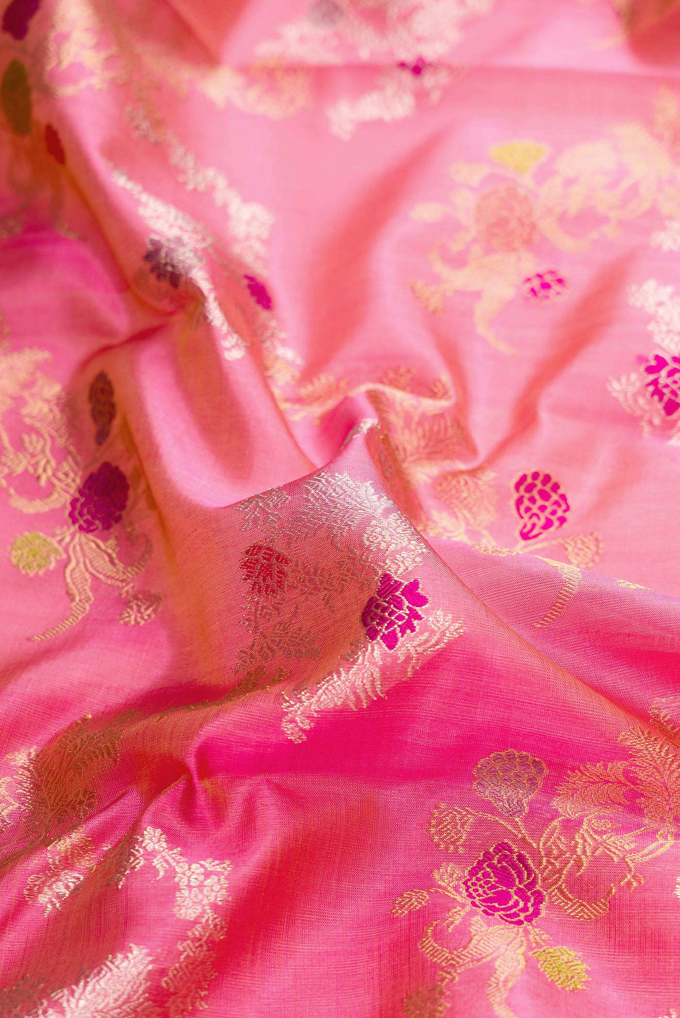 Close up of Pure Silk Pure Zari Pink Dual Tone Kanjivaram Saree with Zari Brocade on the body and Zari Border.  displaying folds