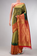 Pure Silk Pure Zari Bottle Green Dual Tone Kanjivaram Saree with Zari Brocade on the body and Fancy Border.  displayed on a mannequin