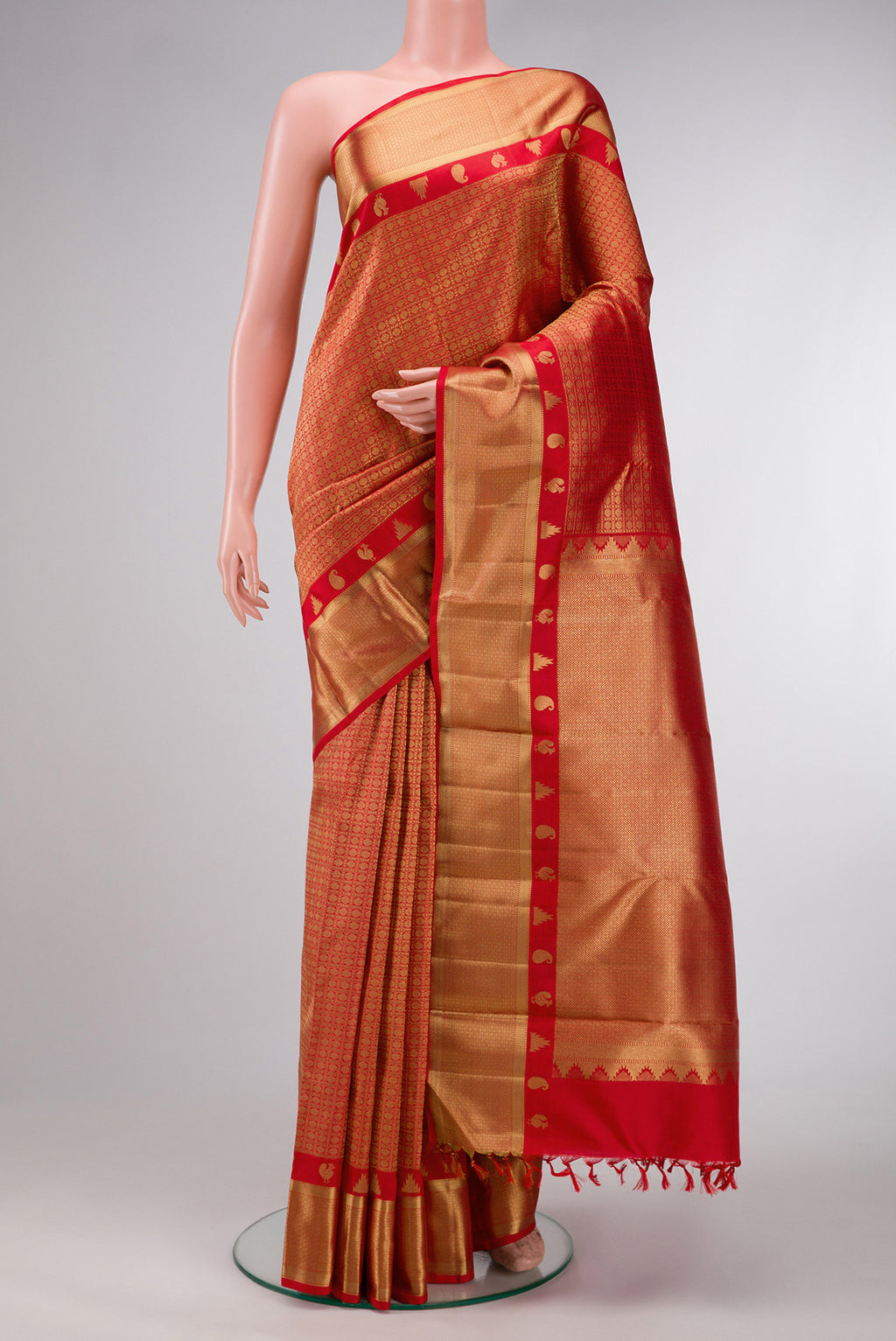 Pure Silk Pure Zari Red Dual Tone Kanjivaram Saree with Zari Brocade on the body and Zari Border.  displayed on a mannequin