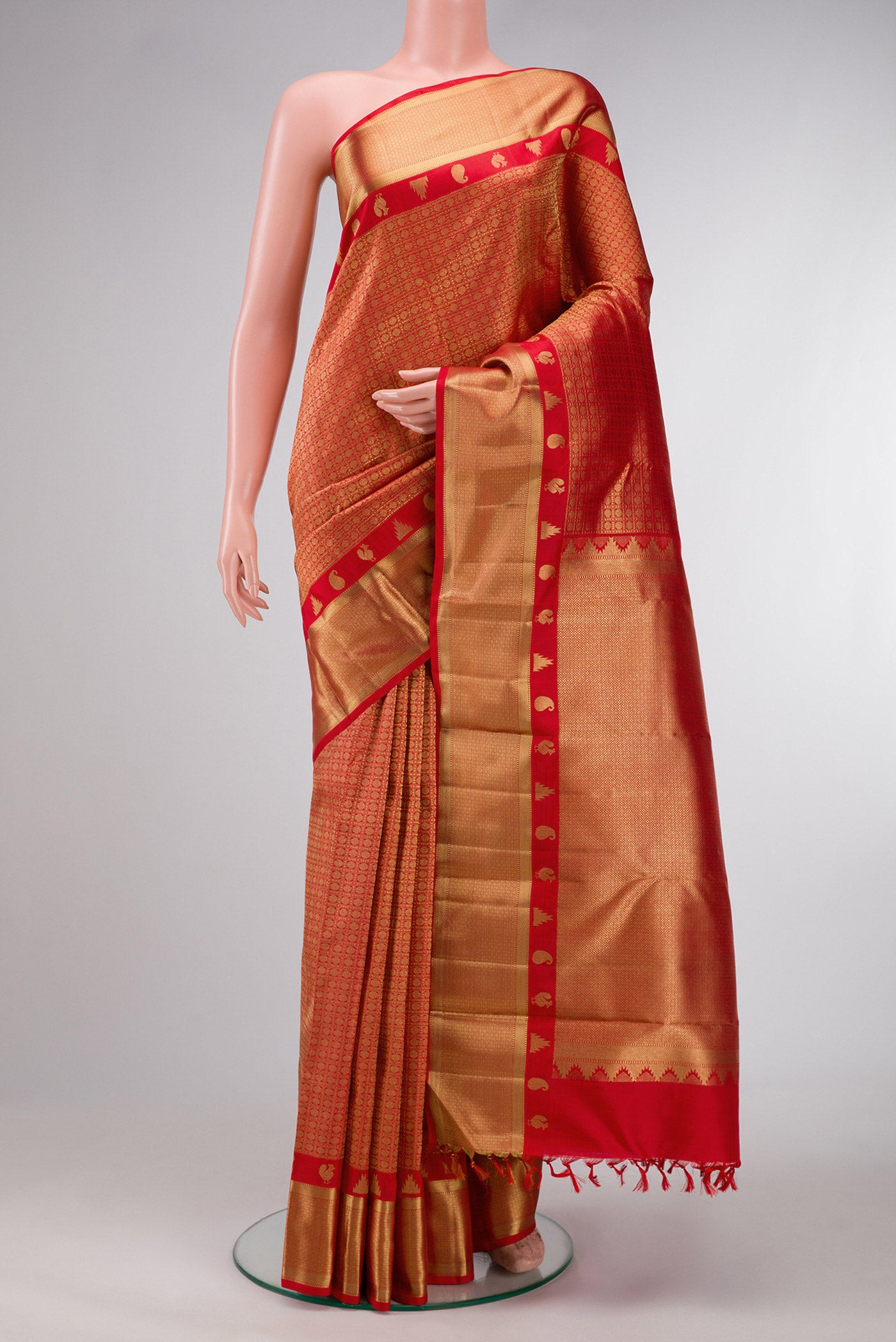 Pure Silk Pure Zari Red Dual Tone Kanjivaram Saree with Zari Brocade on the body and Zari Border.  displayed on a mannequin