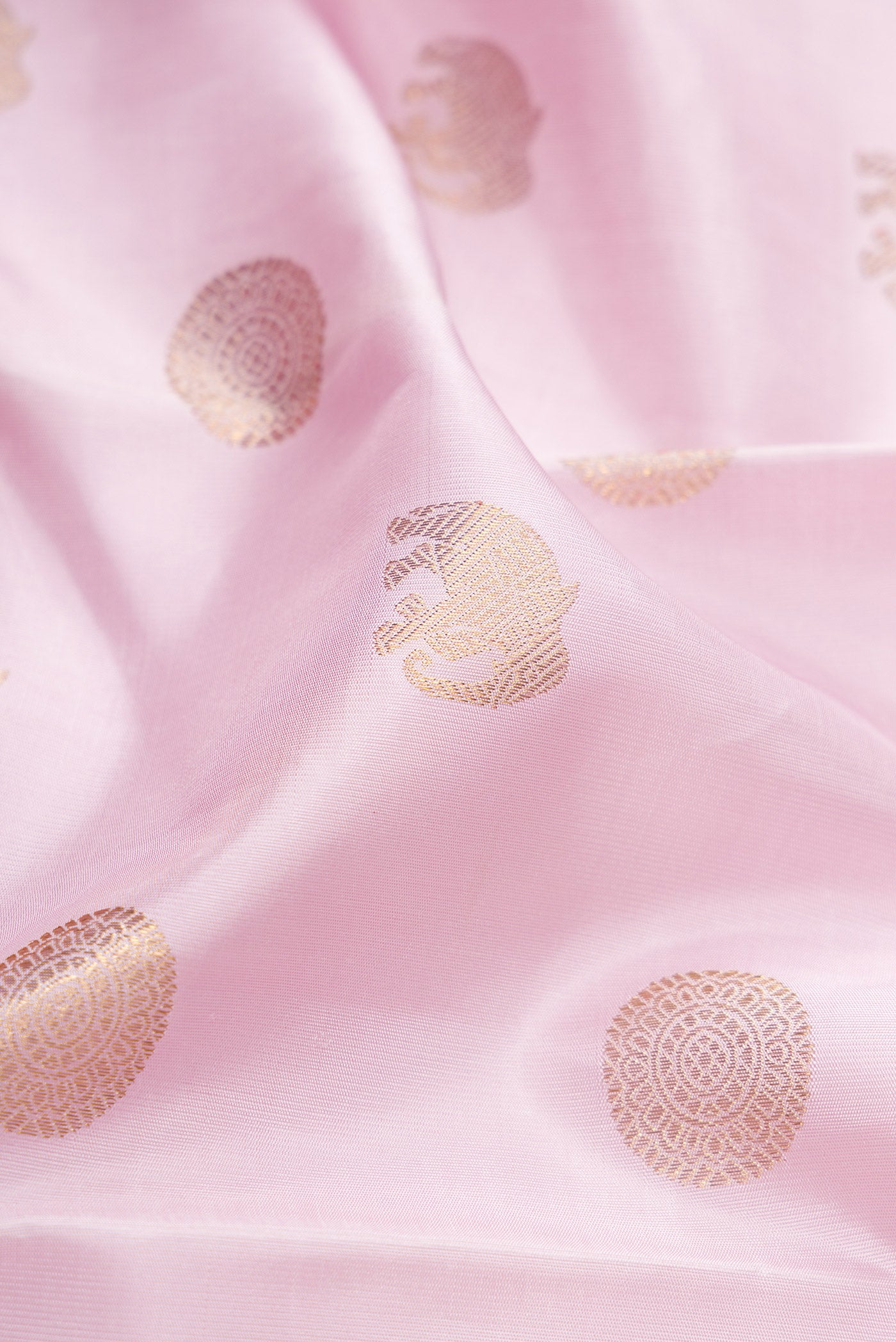 Close up of Pure Silk Pure Zari Lavender Kanjivaram Saree with Zari Butta on the body and Zari Border.  displaying folds