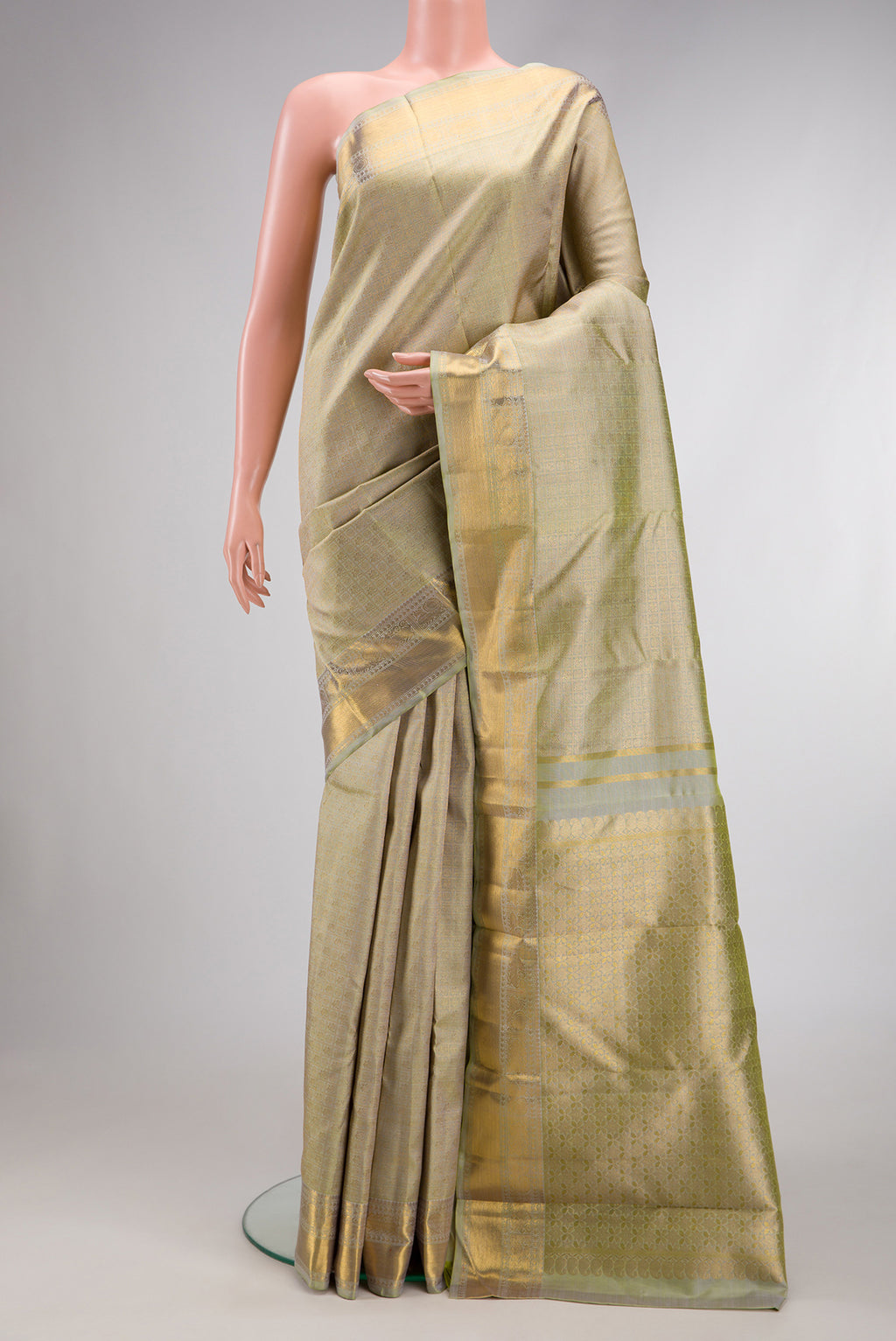 Pure Silk Pure Zari Light Green Dual Tone Kanjivaram Saree with Zari Brocade on the body and Zari Border.  displayed on a mannequin
