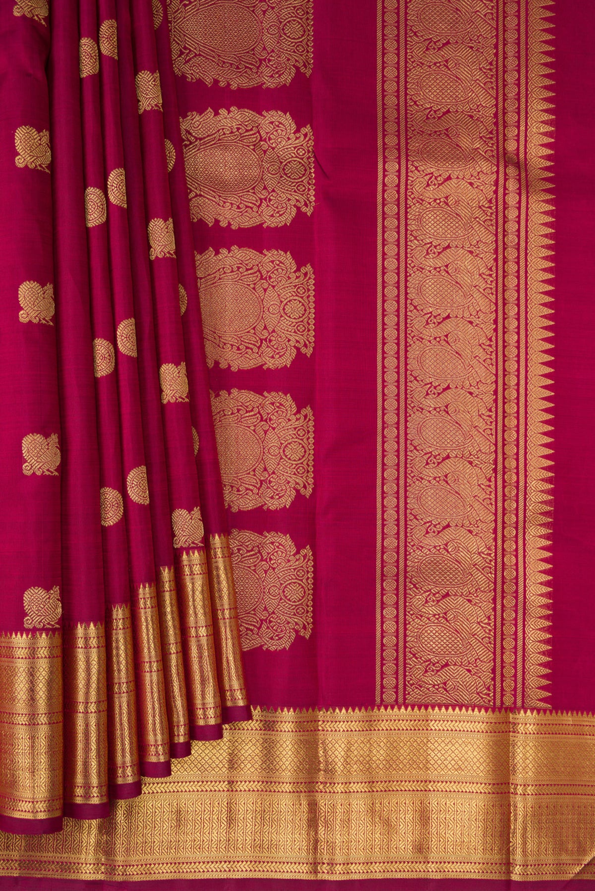 Pleats and pallu of Pure Silk Pure Zari Maroon Kanjivaram Saree with Zari Butta on the body and Zari Border. 