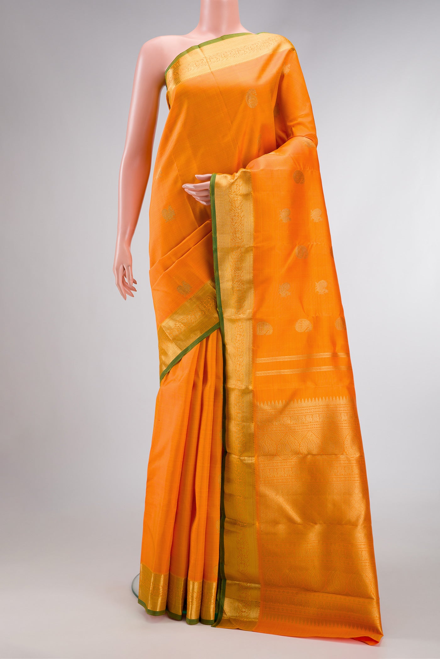 Pure Silk Pure Zari Orange Dual Tone Kanchipuram Saree with Zari Butta on the body and Zari Border.  displayed on a mannequin