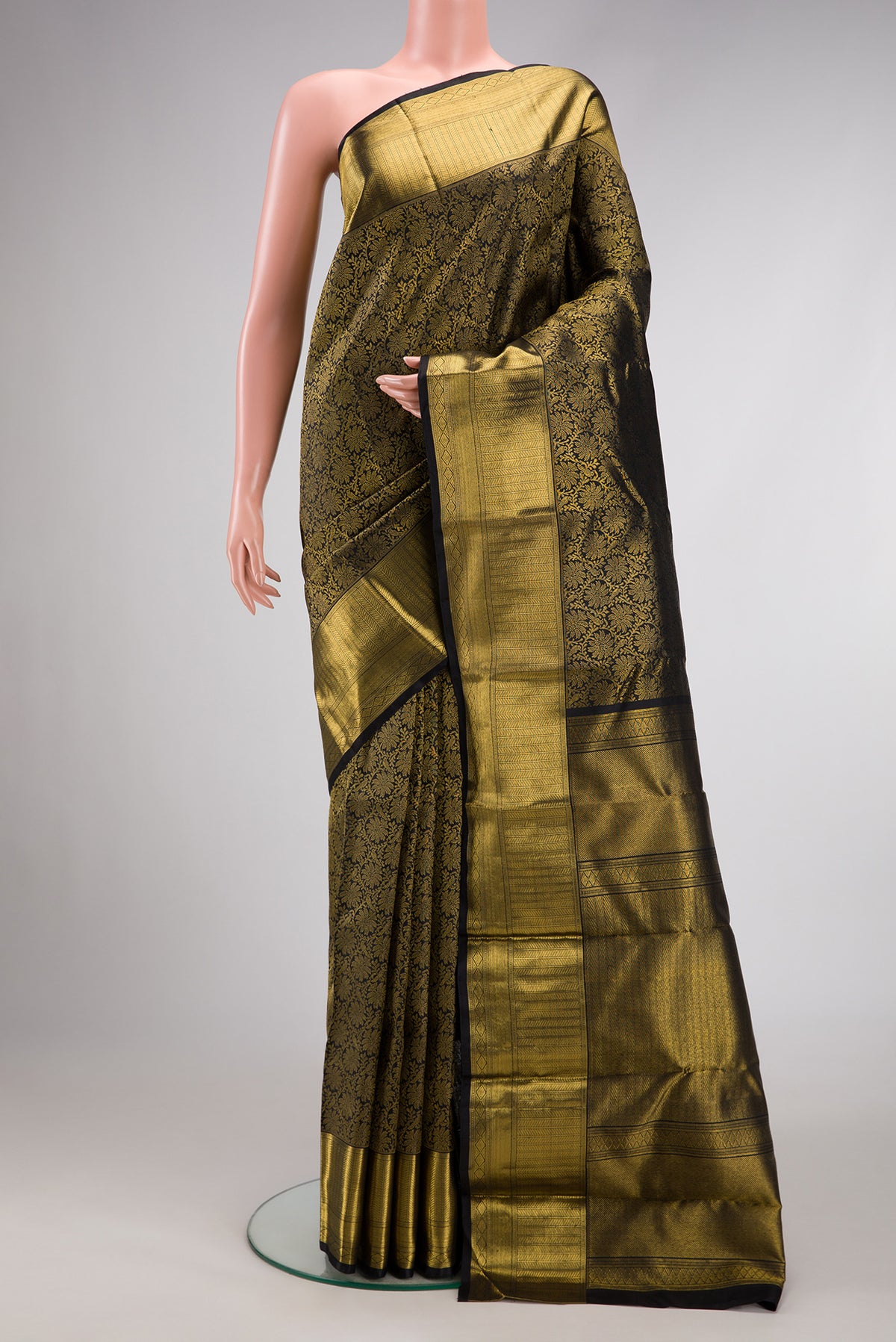 Pure Silk Pure Zari Black Dual Tone Kanjivaram Saree with Zari Brocade on the body and Zari Border.  displayed on a mannequin