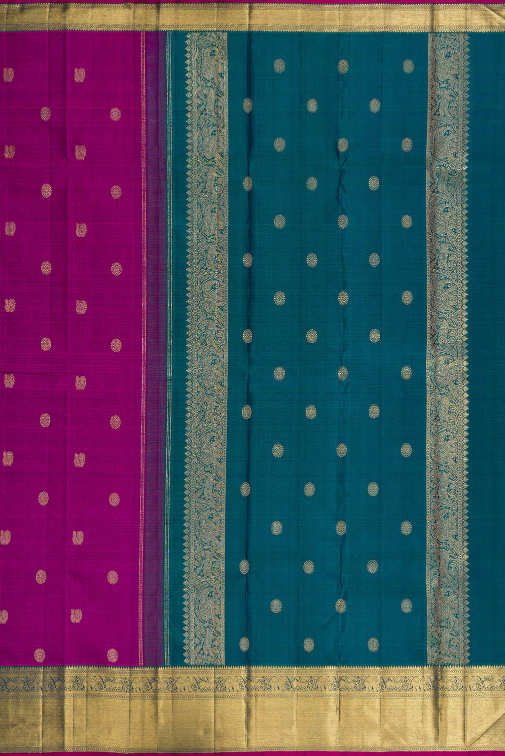 Close up image of the pallu of Pure Silk Pure Zari Magenta Dual Tone Kanchipuram Saree with Zari Butta on the body and Zari Border. 