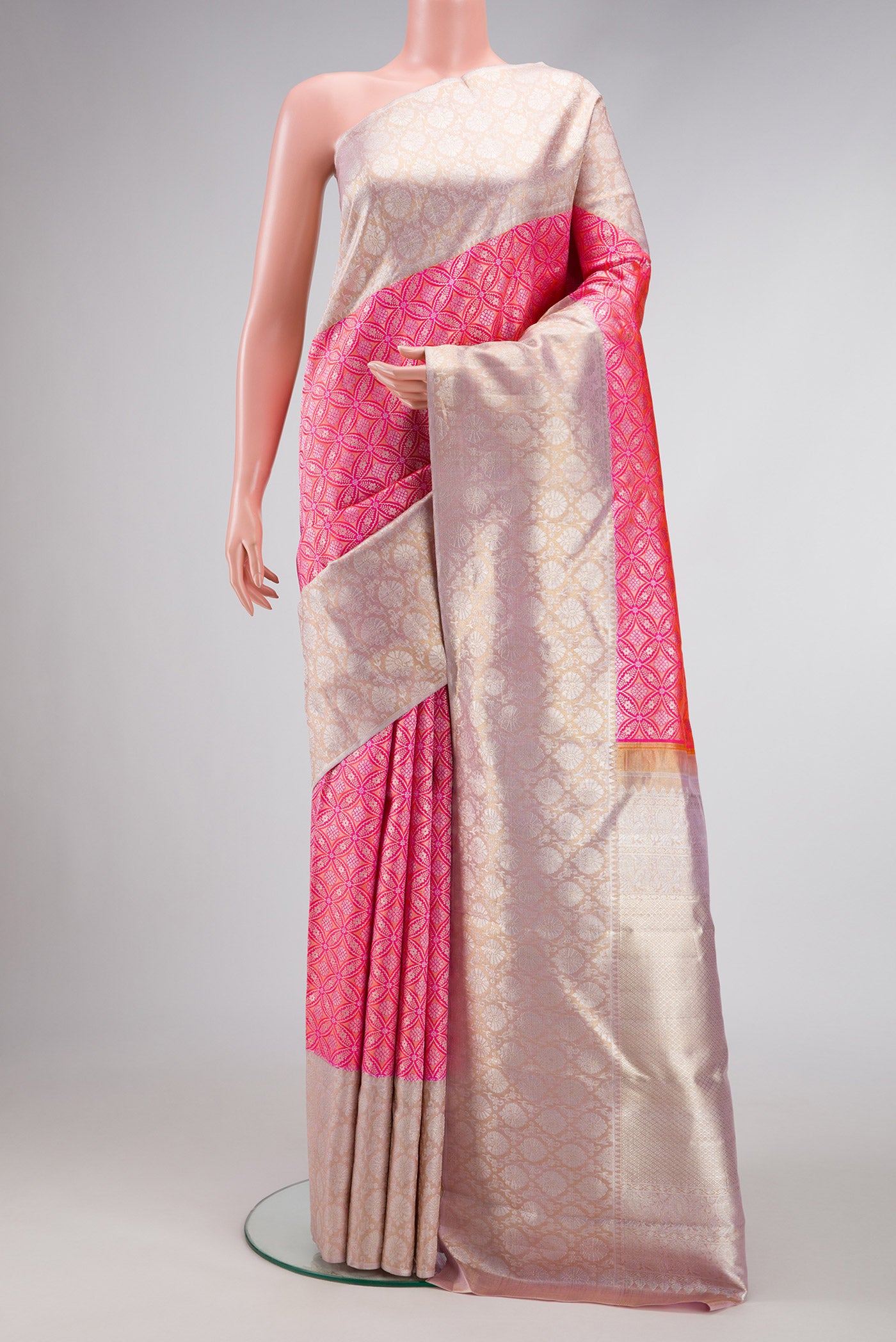 Pink Dual Tone Kanjivaram Silk Saree with Zari Brocade on the body and Zari Border.  displayed on a mannequin