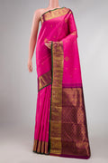 Pink Kanchipuram Silk Saree with Zari Butta on the body and Zari Border displayed on a mannequin