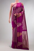 Magenta Kanchipuram Silk Saree with Zari Brocade on the body and Fancy Border.  displayed on a mannequin