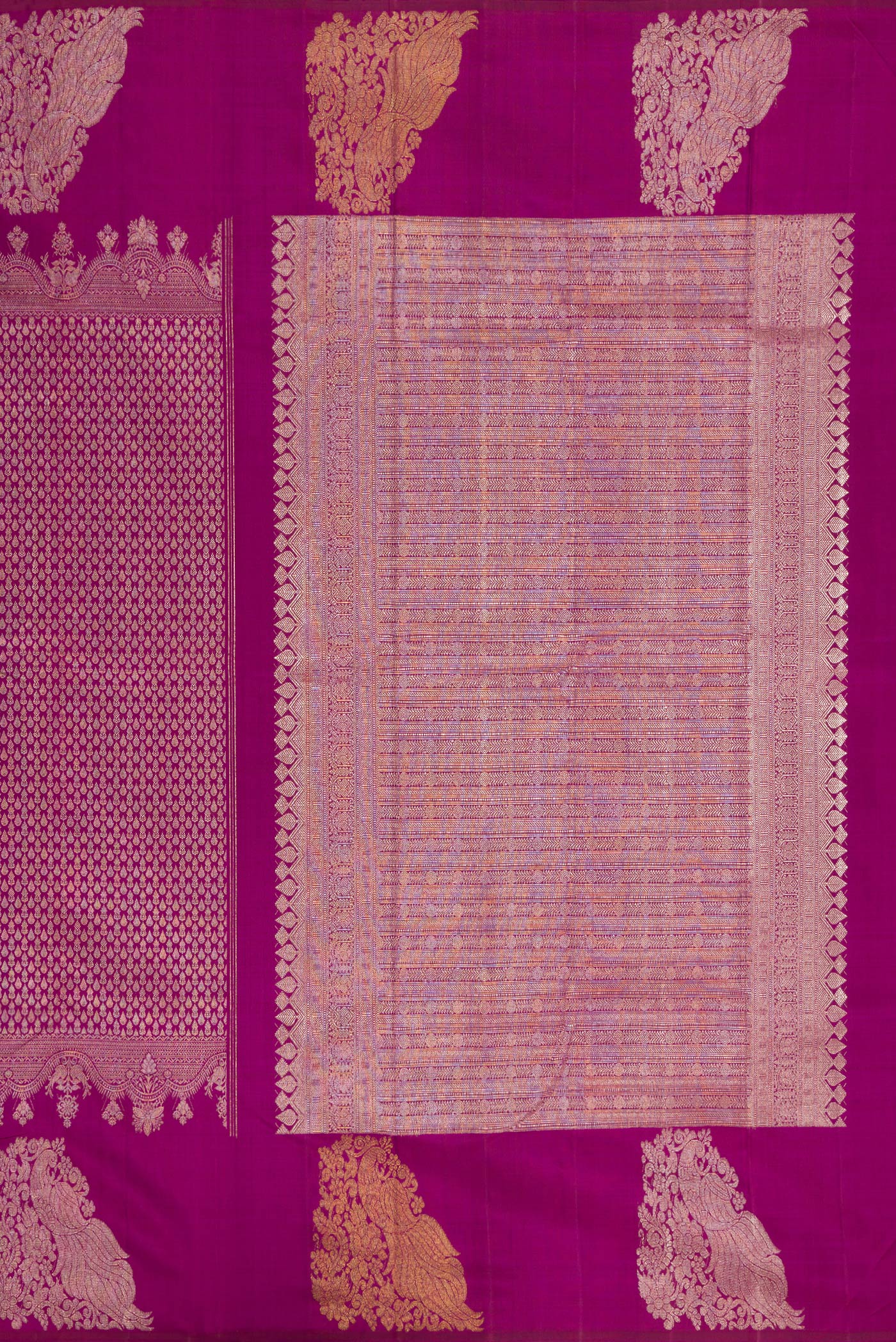 Close up image of the pallu of Magenta Kanchipuram Silk Saree with Zari Brocade on the body and Fancy Border. 