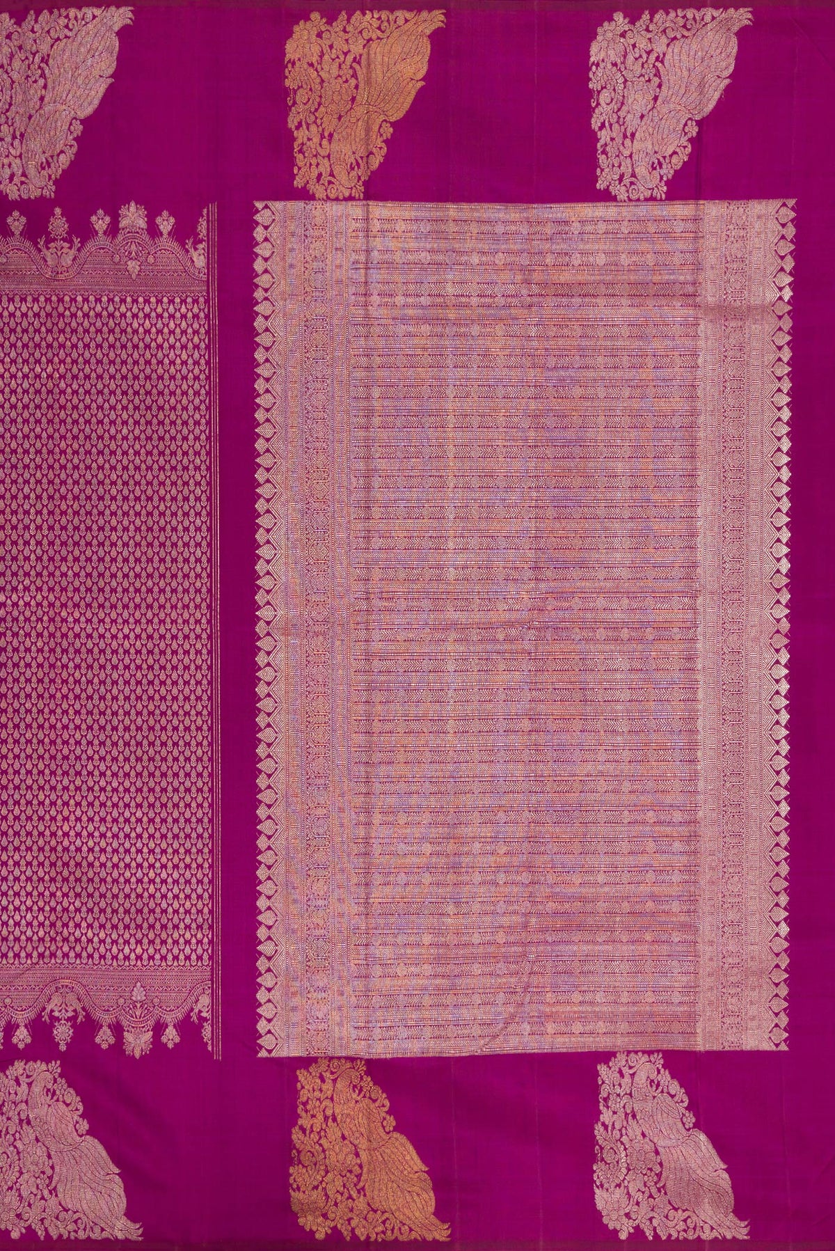Close up image of the pallu of Magenta Kanchipuram Silk Saree with Zari Brocade on the body and Fancy Border. 