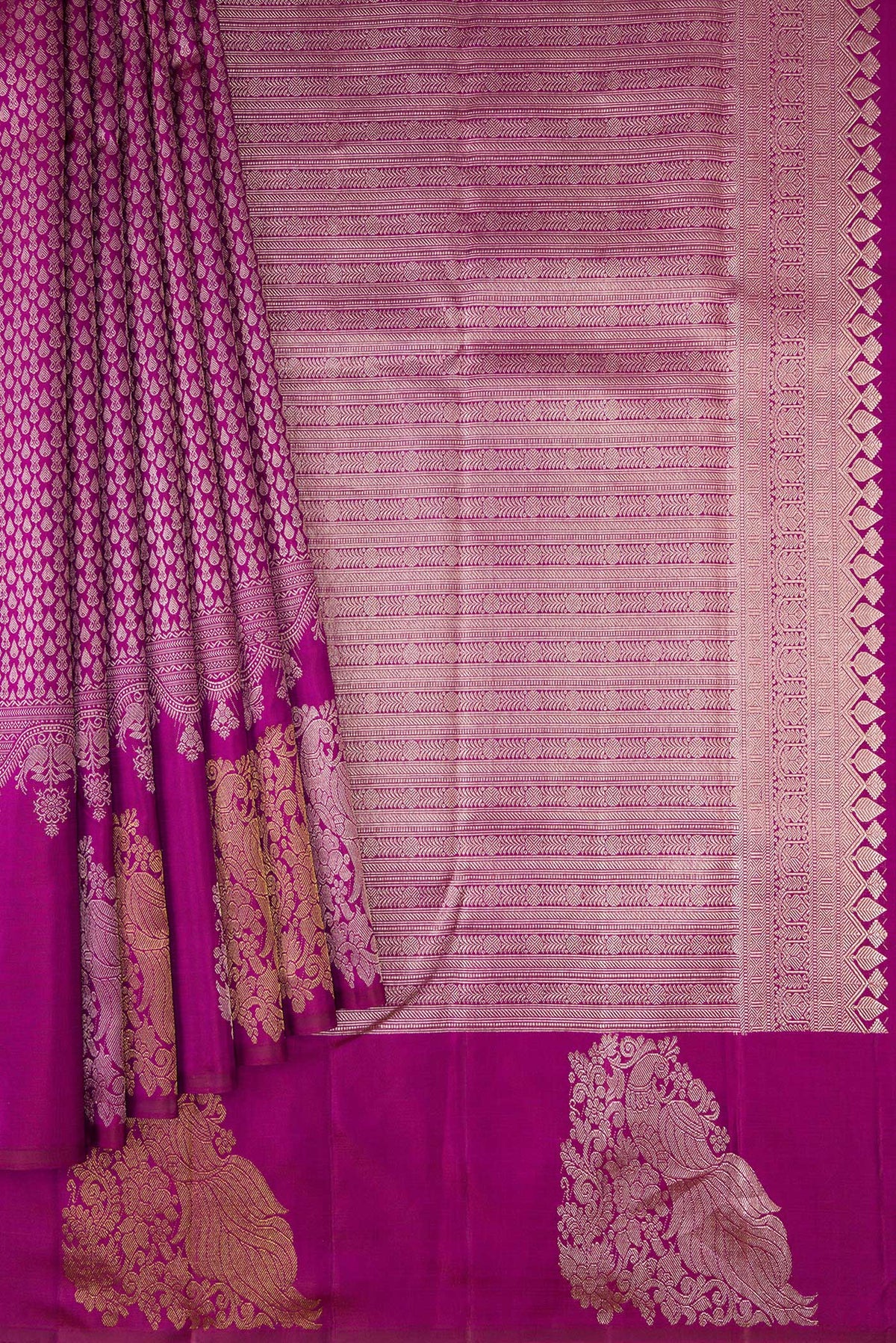 Pleats and pallu of Magenta Kanchipuram Silk Saree with Zari Brocade on the body and Fancy Border. 