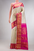 Off White Dual Tone Kanchipuram Silk Saree with Zari Brocade on the body and Zari Border.  displayed on a mannequin
