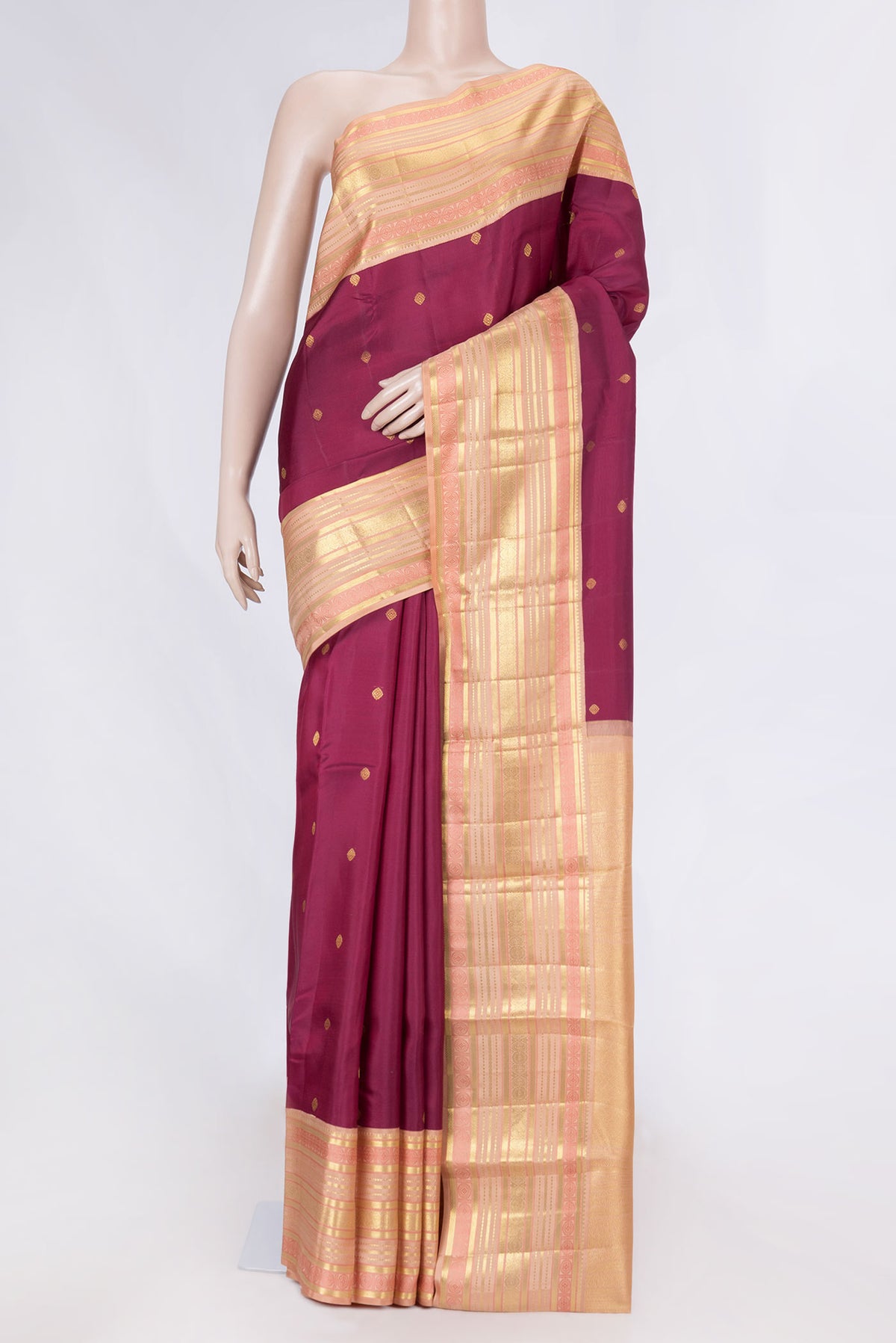 Magenta Dual Tone Kanchipuram Saree with Zari Butta on the body and Zari And Thread Border displayed on a mannequin