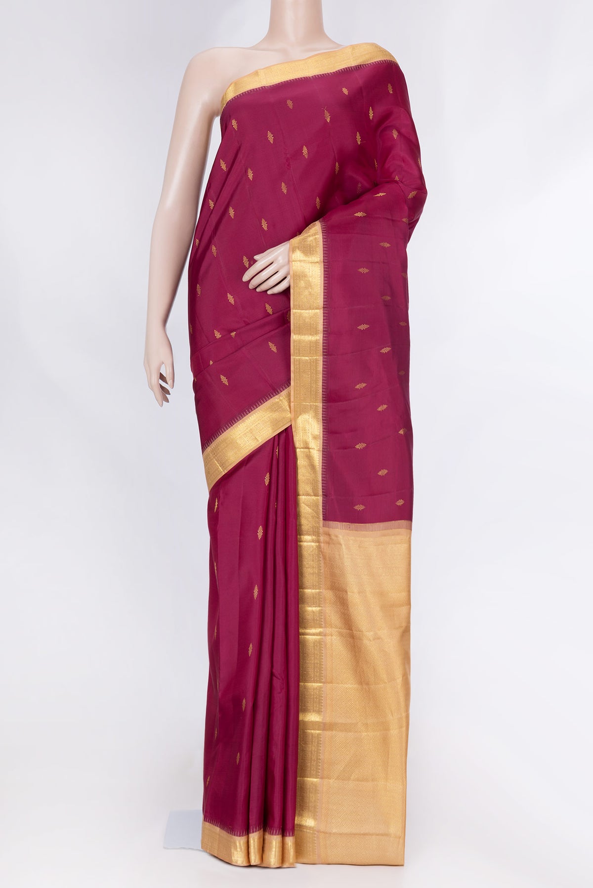 Magenta Dual Tone Kanchipuram Saree with Zari Butta on the body and Zari Border displayed on a mannequin