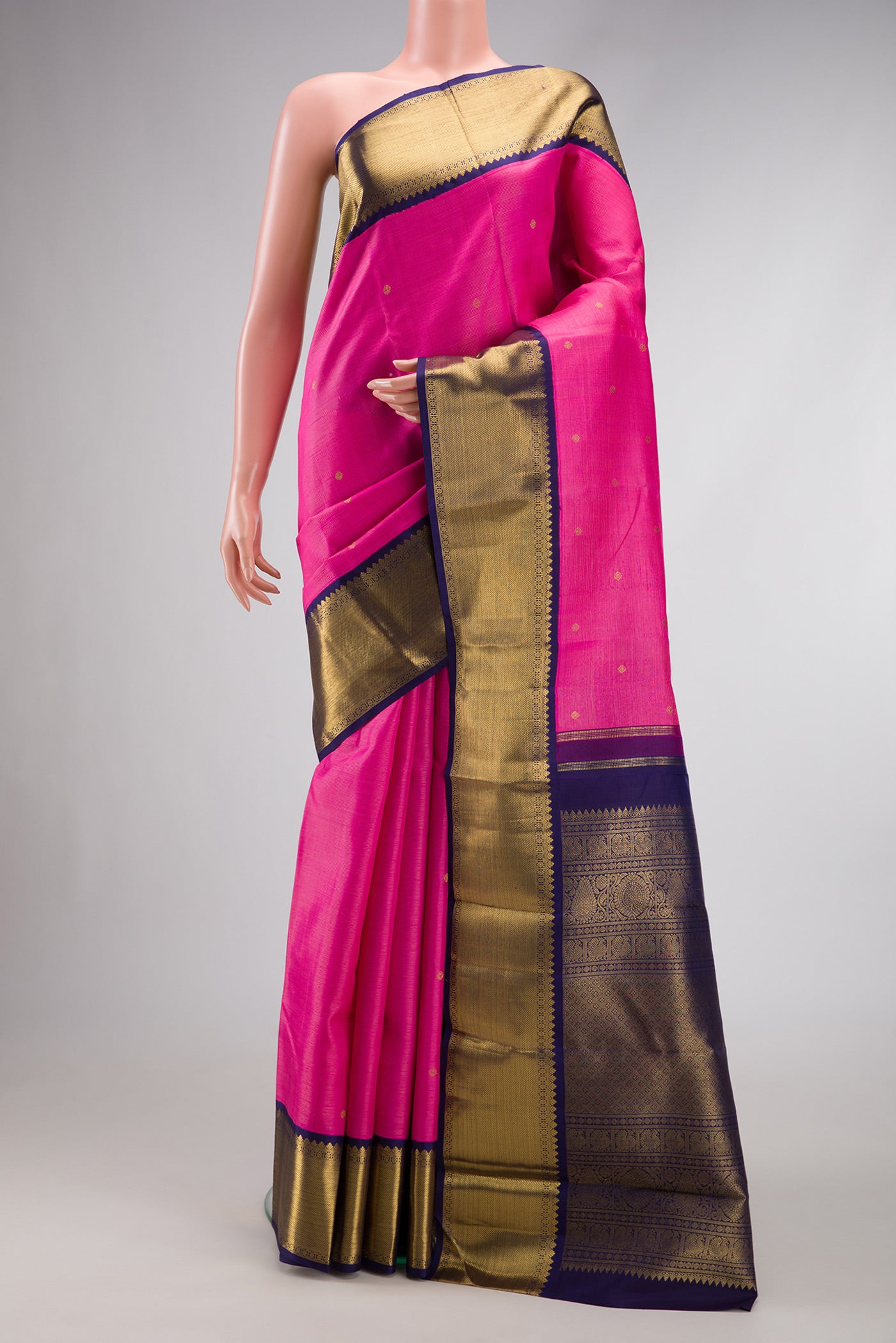 Pure Silk Pure Zari Pink Dual Tone Kanjivaram Saree with Zari Butta on the body and Zari Border.  displayed on a mannequin