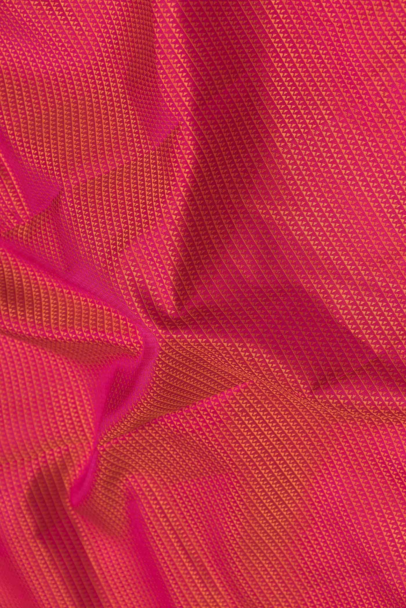 Close up of Pure Silk Pure Zari Pink Dual Tone Kanchipuram SareeJacquard design on the body and Zari Border displaying folds