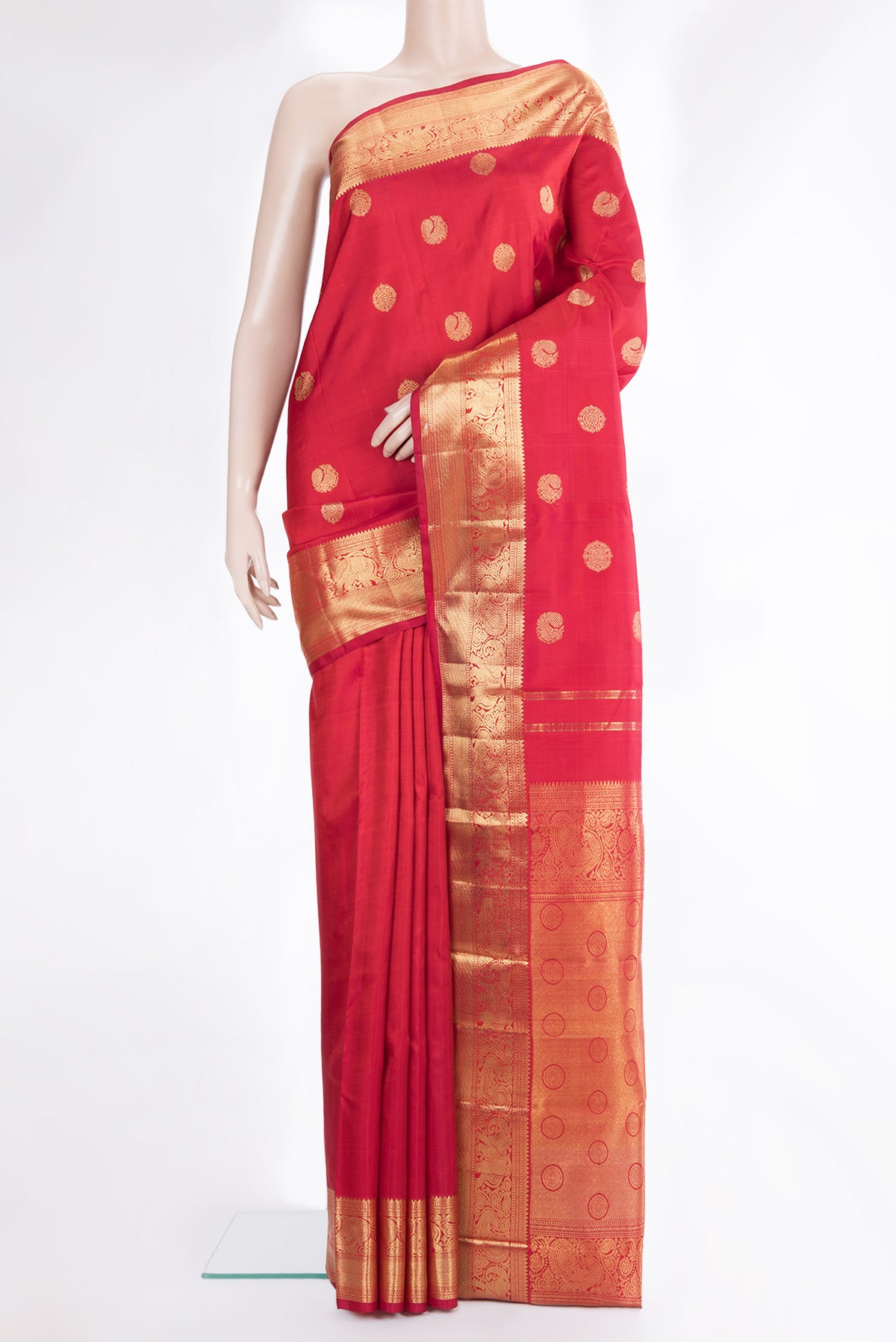 Pure Silk Pure Zari Red Kanchipuram Saree with Zari Butta on the body and Zari Border.  displayed on a mannequin