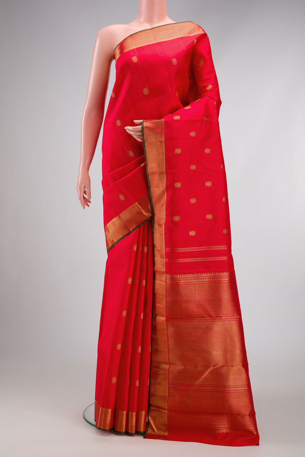 Red Dual Tone Kanchipuram Silk Saree with Zari Butta on the body and Zari Border.  displayed on a mannequin
