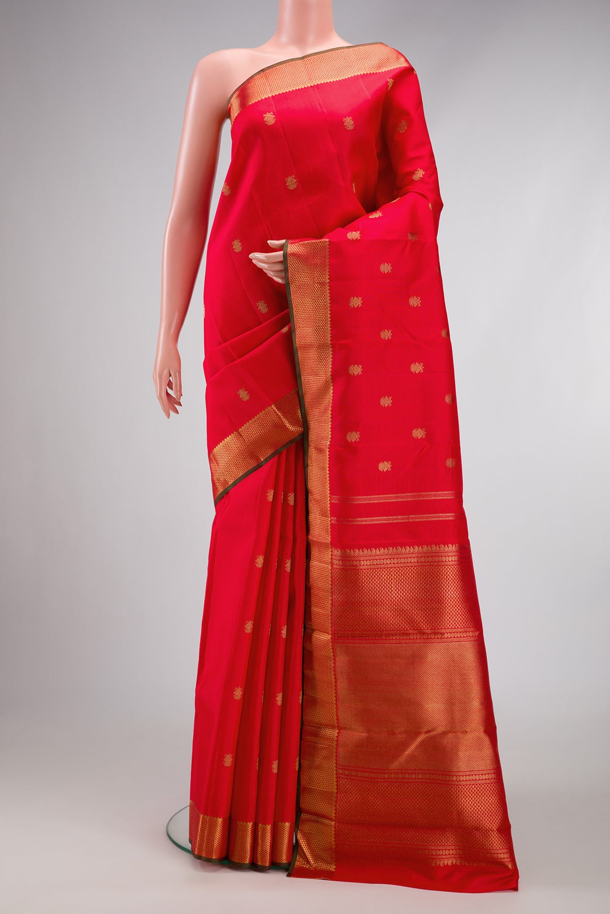 Red Dual Tone Kanchipuram Silk Saree with Zari Butta on the body and Zari Border.  displayed on a mannequin