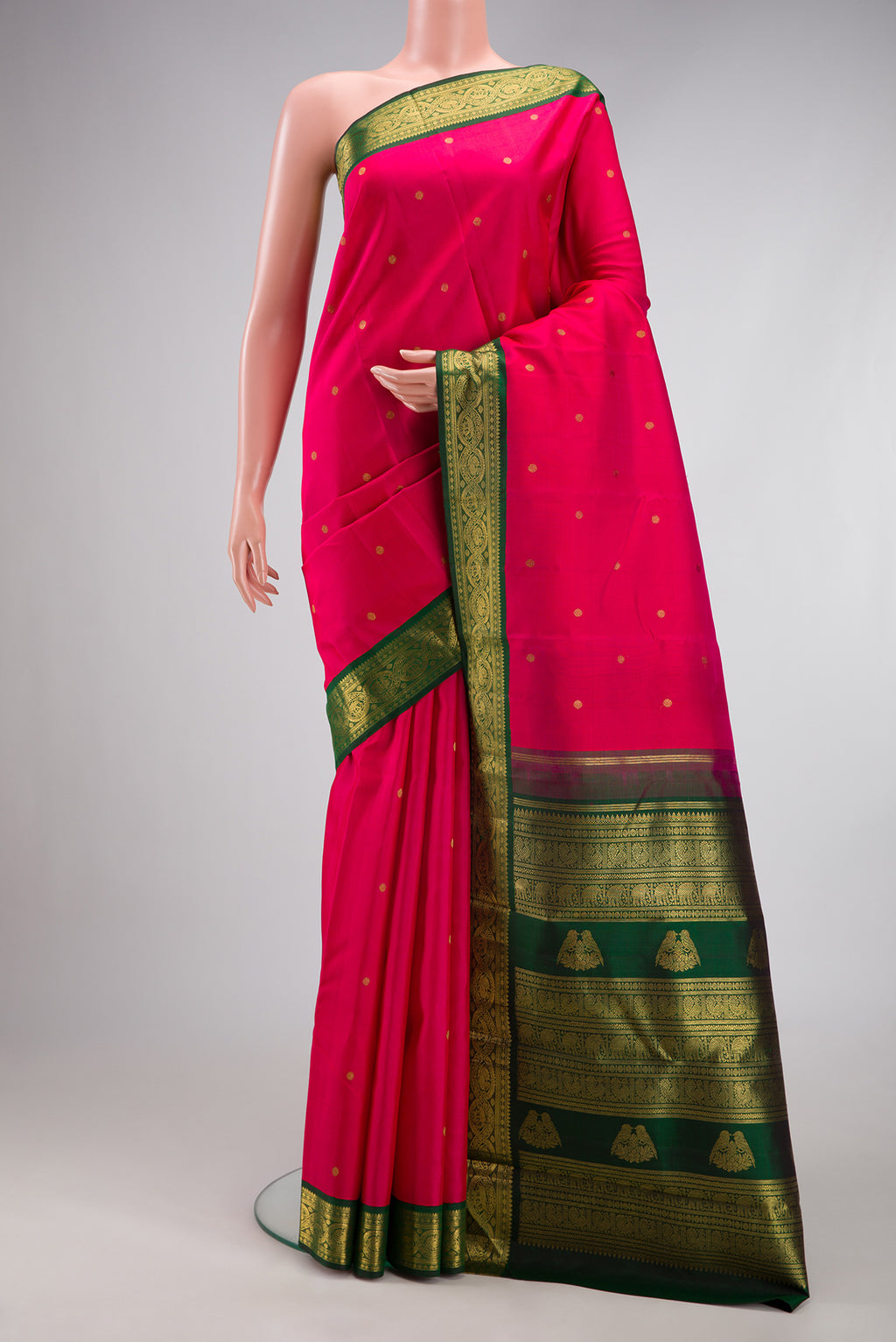 Pure Silk Pure Zari Dark Pink Kanchipuram Saree with Zari Butta on the body and Zari Border.  displayed on a mannequin