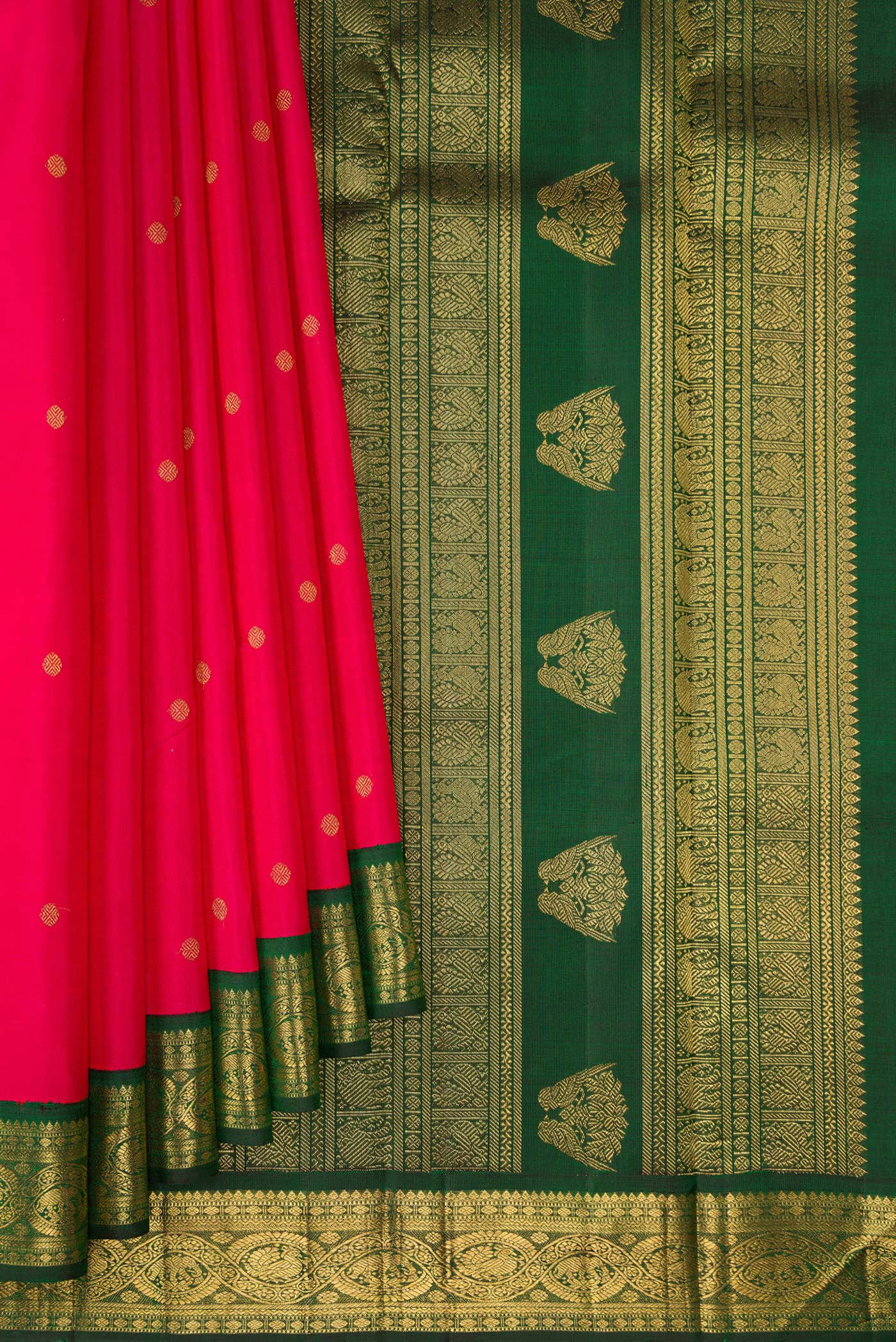 Pleats and pallu of Pure Silk Pure Zari Dark Pink Kanchipuram Saree with Zari Butta on the body and Zari Border. 
