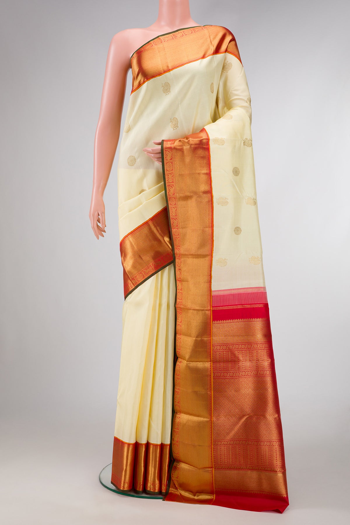 Pure Silk Pure Zari Sandal Dual Tone Kanjivaram Saree with Zari Butta on the body and Zari Border.  displayed on a mannequin