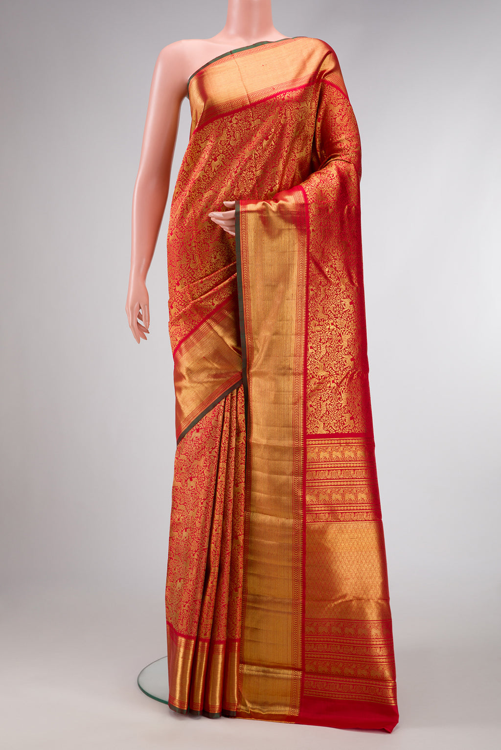 Pure Silk Pure Zari Red Dual Tone Kanjivaram Saree with Zari Brocade on the body and Zari Border.  displayed on a mannequin