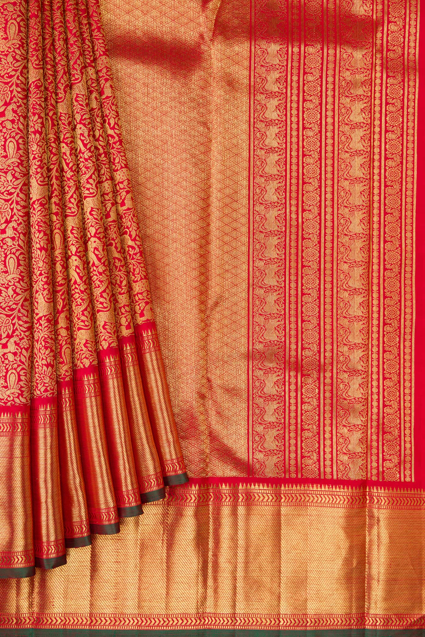 Pleats and pallu of Pure Silk Pure Zari Red Dual Tone Kanjivaram Saree with Zari Brocade on the body and Zari Border. 