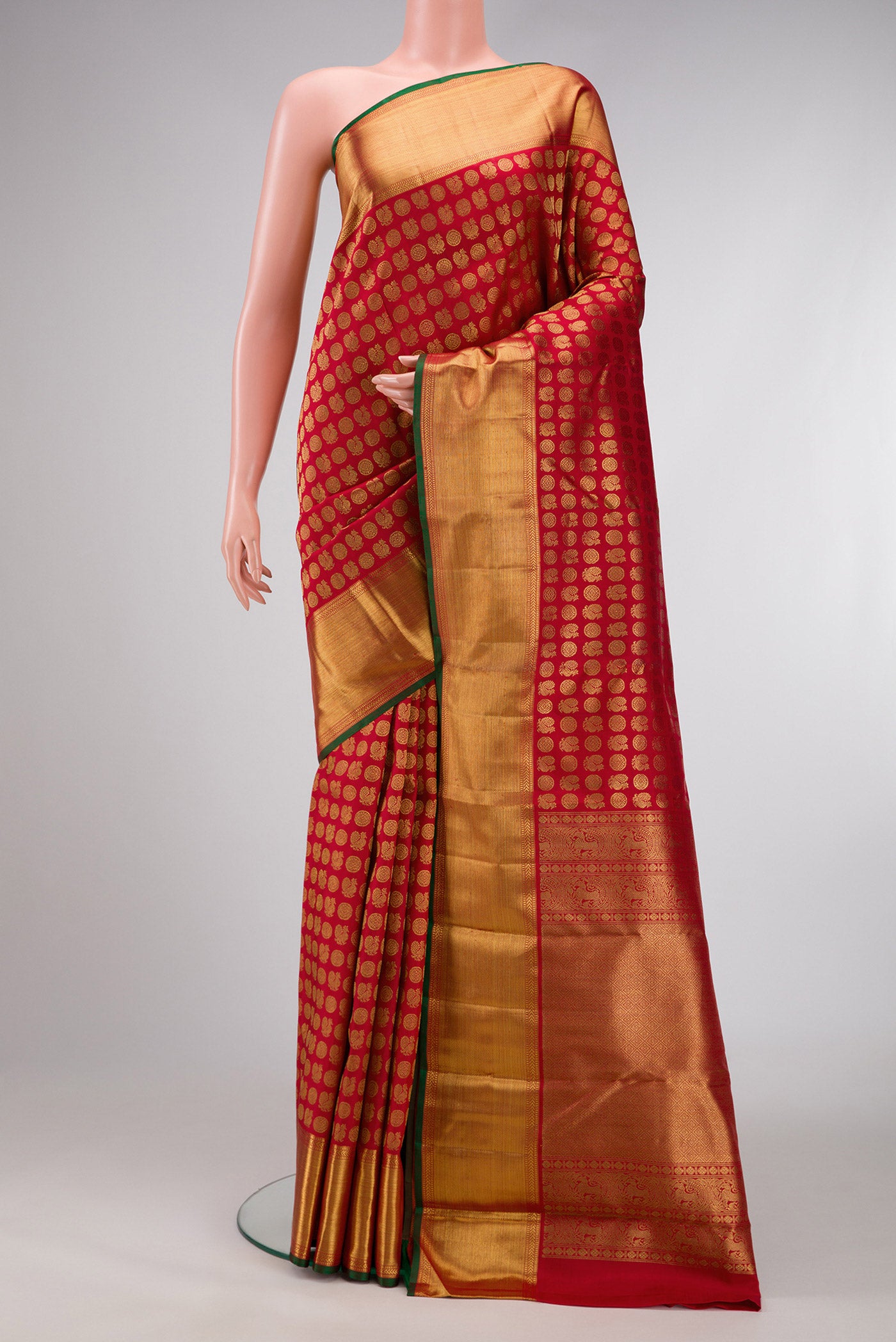 Pure Silk Pure Zari Red Dual Tone Kanjivaram Saree with Zari Brocade on the body and Zari Border.  displayed on a mannequin