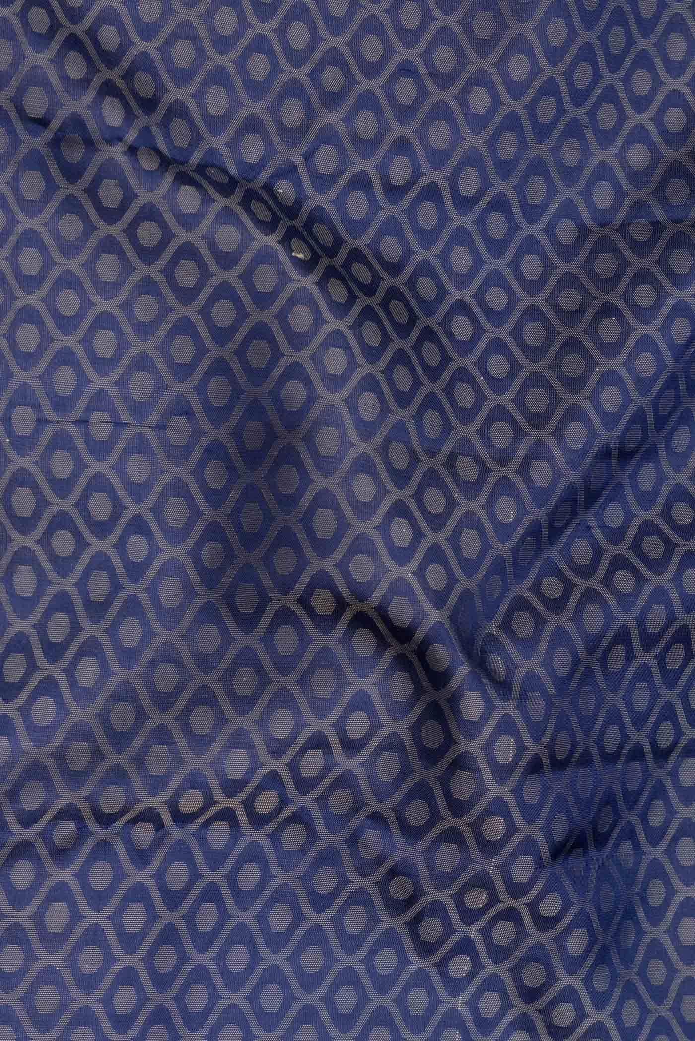 Close up of Navy Blue Dual Tone Kanchipuram Saree with Jacquard design on the body and Thread Border.  displaying folds