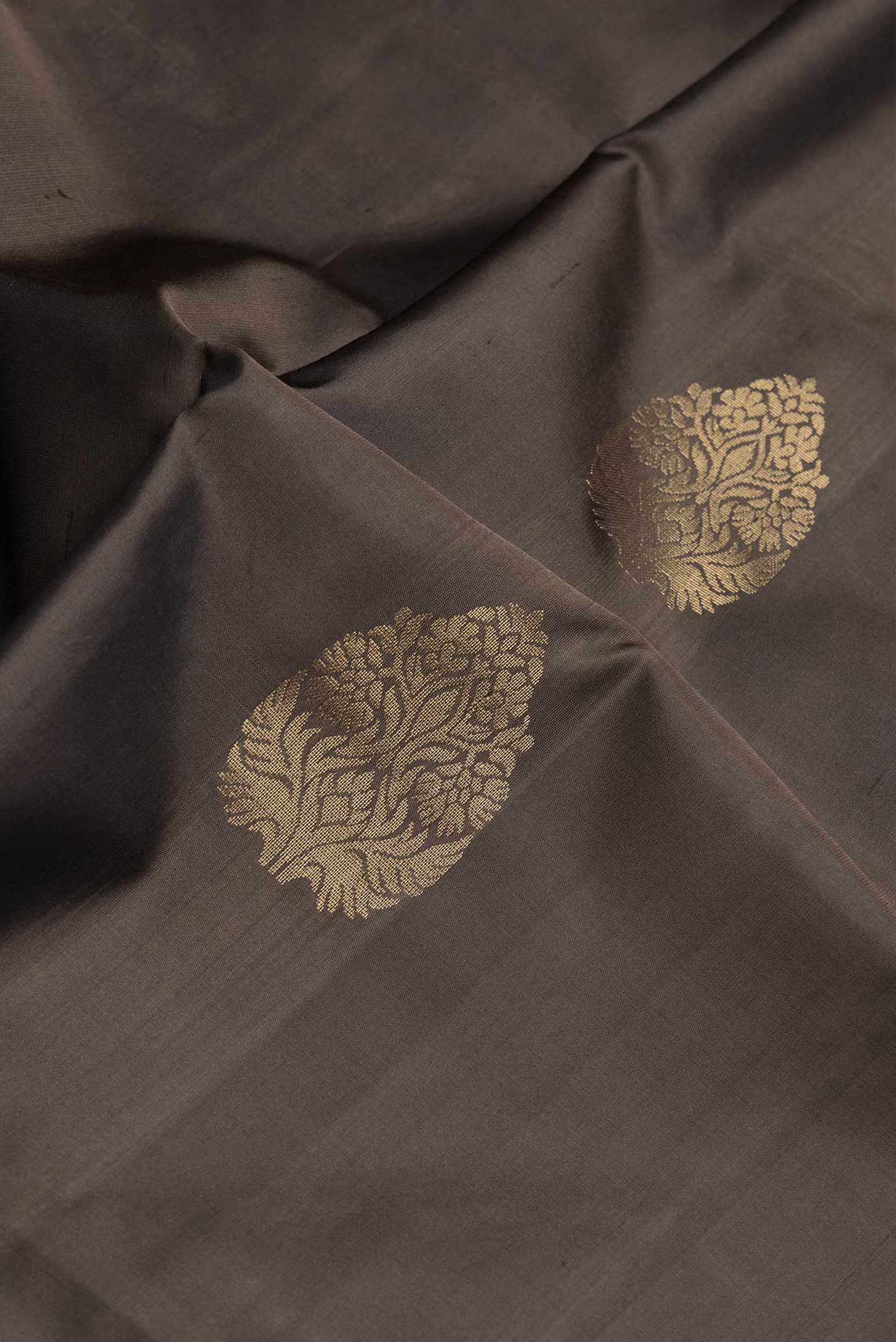 Close up of Coffee Brown Dual Tone Soft Silk Saree with Zari Butta on the body and Thread Border.  displaying folds