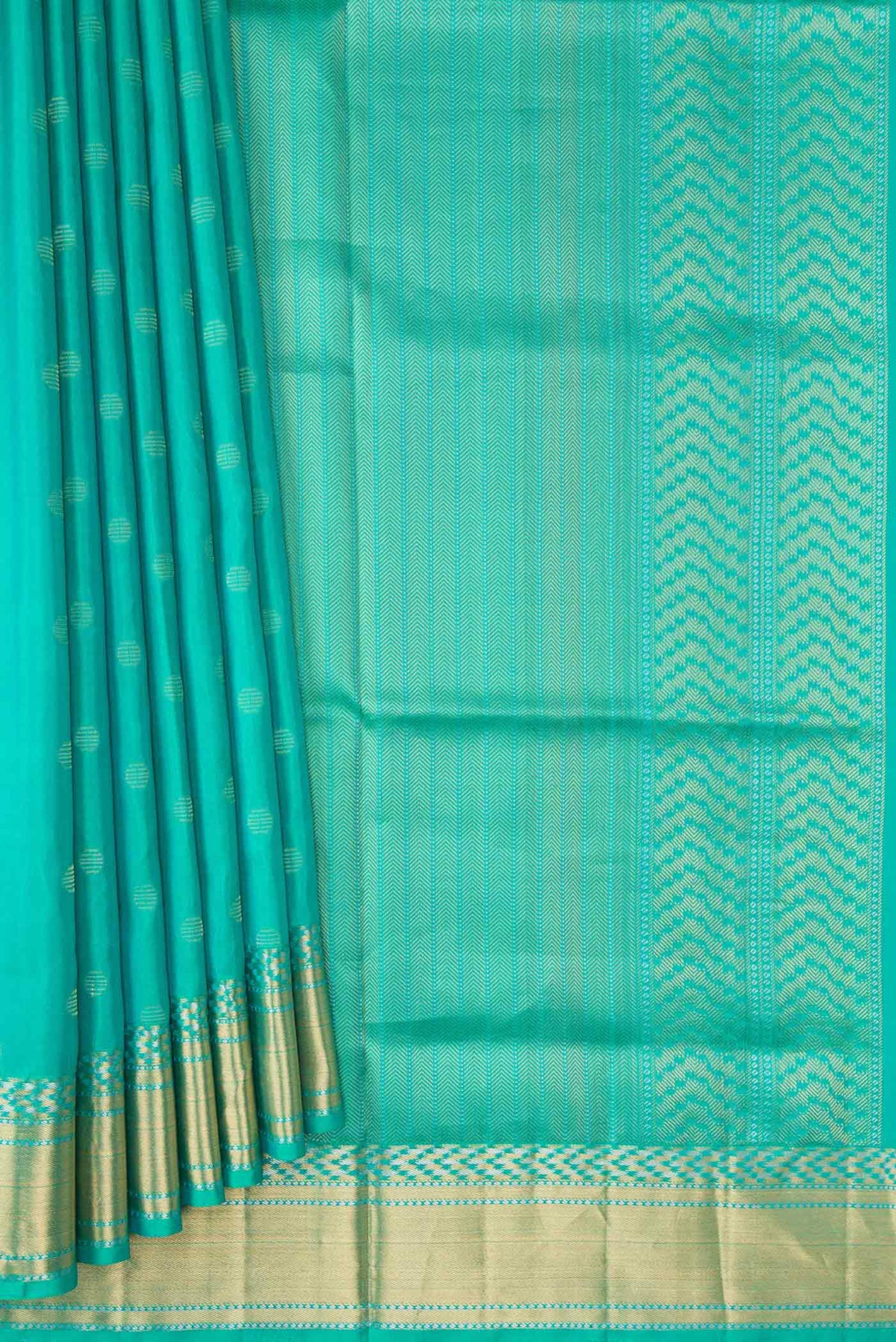 Pleats and pallu of Sea Green Dual Tone Soft Silk Saree with Zari Butta on the body and Zari Border. 