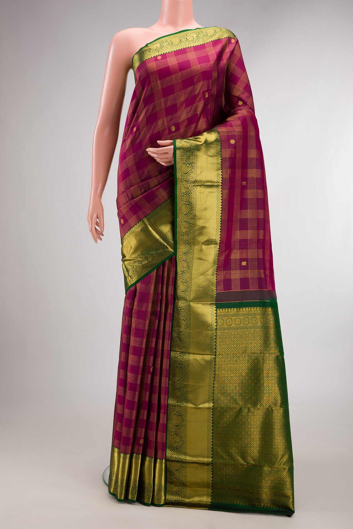 Pure Silk Burgundy Kanjivaram Saree with Checked design on the body and Zari Border.  displayed on a mannequin