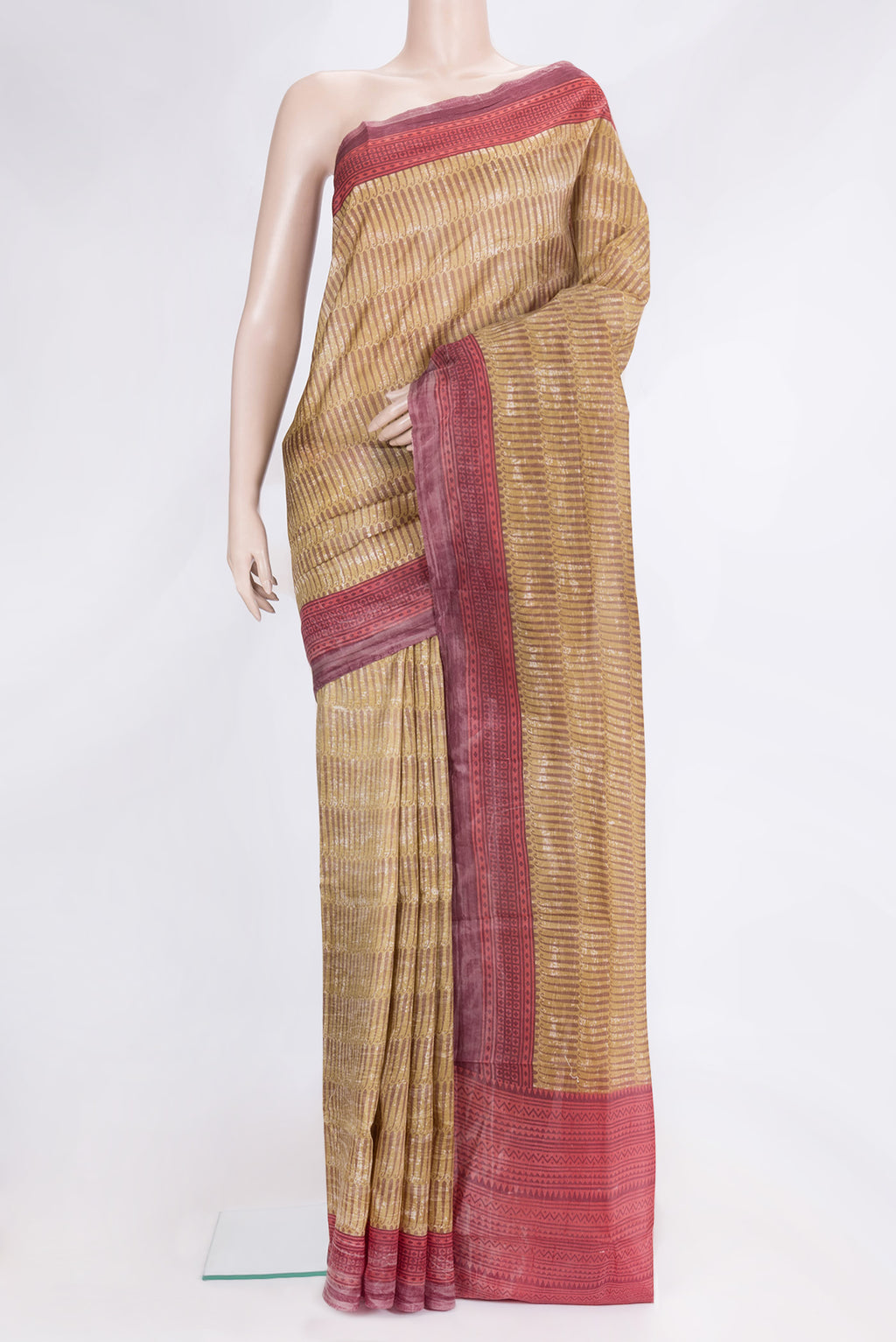Mustard Dual Tone Tussar Silk Saree with Printed design on the body and Printed Border.  displayed on a mannequin
