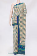 Beige Crepe Saree with Printed design on the body and Printed Border.  displayed on a mannequin