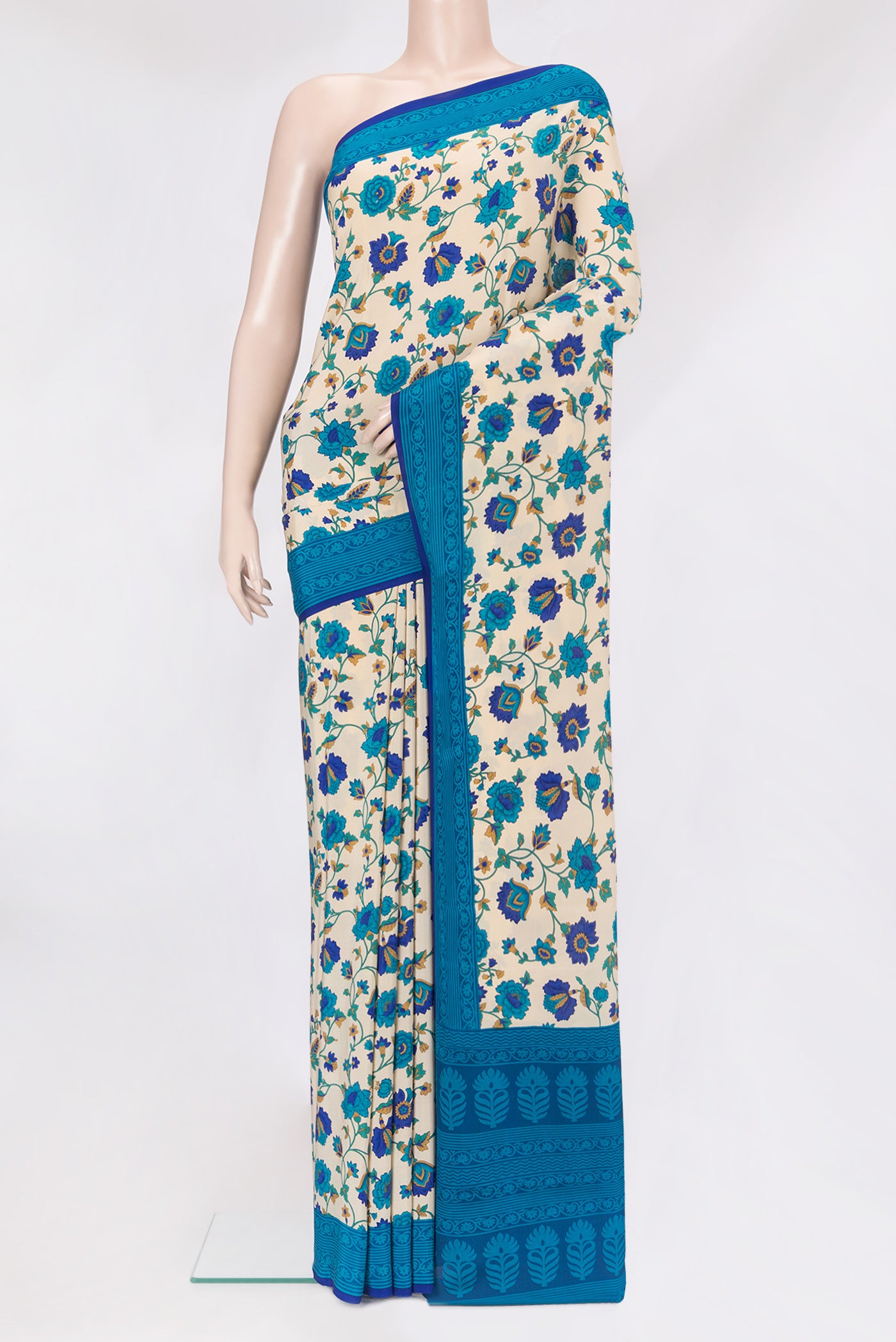 Beige Crepe Saree with Printed design on the body and Printed Border.  displayed on a mannequin