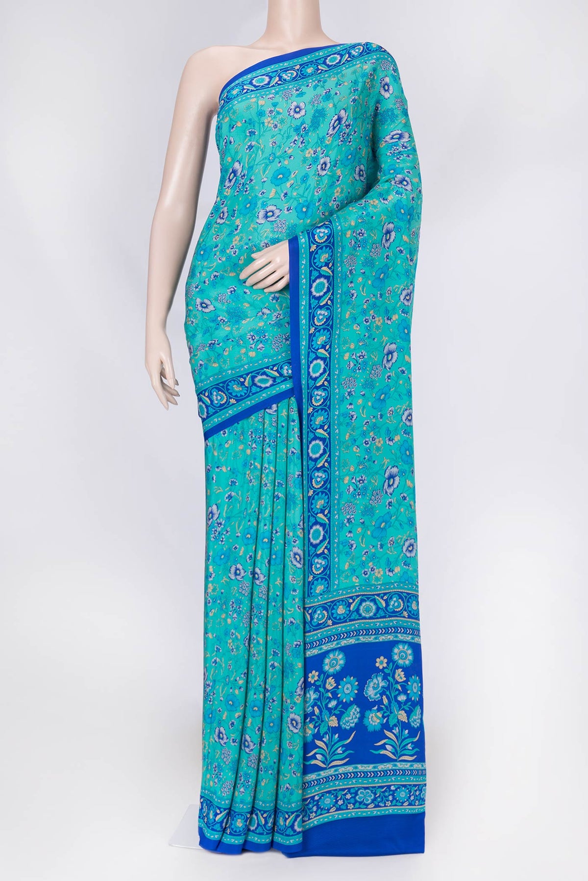 Sky Blue Dual Tone Mysore Crepe Saree with Printed design on the body and Plain Border displayed on a mannequin