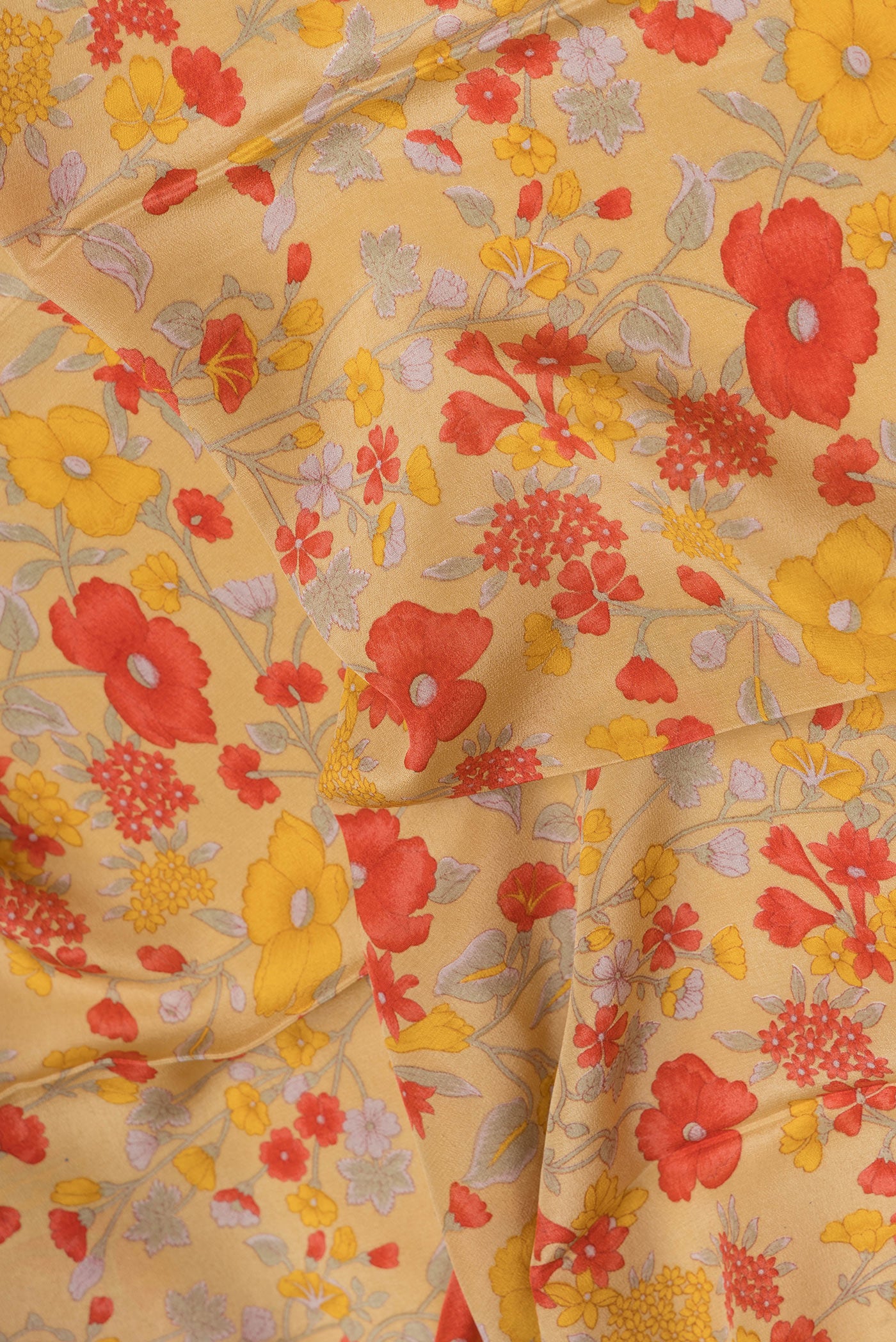 Close up of Sandal Crepe Saree with Floral Print on the body and Printed Border.  displaying folds