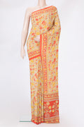 Sandal Crepe Saree with Floral Print on the body and Printed Border.  displayed on a mannequin