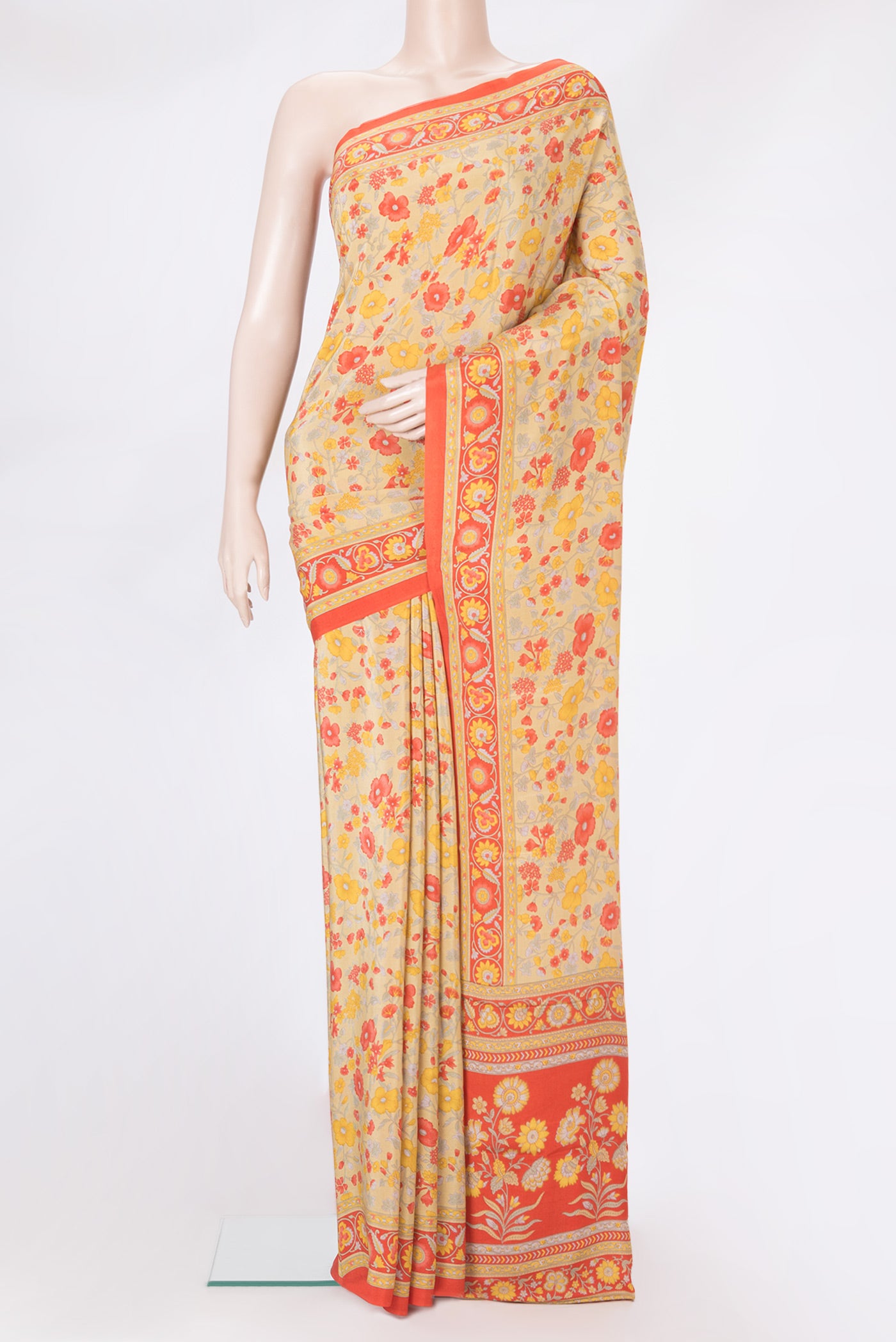 Sandal Crepe Saree with Floral Print on the body and Printed Border.  displayed on a mannequin