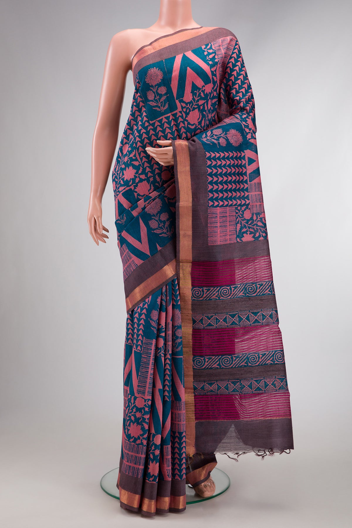Peacock Blue Dual Tone Tussar Silk Saree with Printed design on the body and Zari Border.  displayed on a mannequin