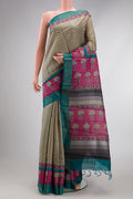 Beige Dual Tone Tussar Silk Saree with Printed design on the body and Fancy Border.  displayed on a mannequin