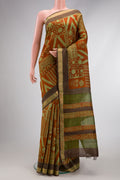 Brick Orange Dual Tone Tussar Silk Saree with Printed design on the body and Zari Border.  displayed on a mannequin