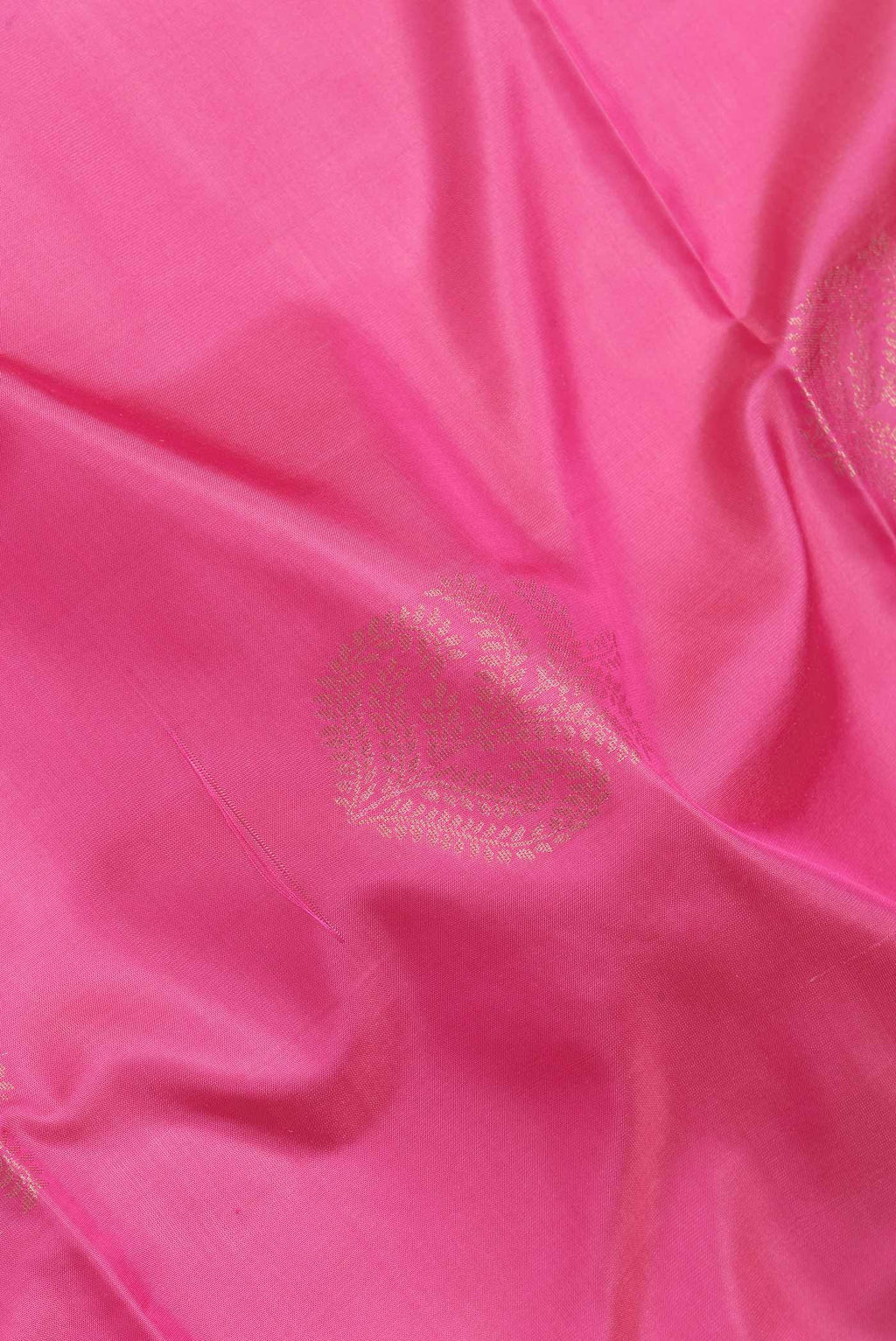Close up of Pink Dual Tone Soft Silk Saree with Zari Butta on the body and Zari Border.  displaying folds