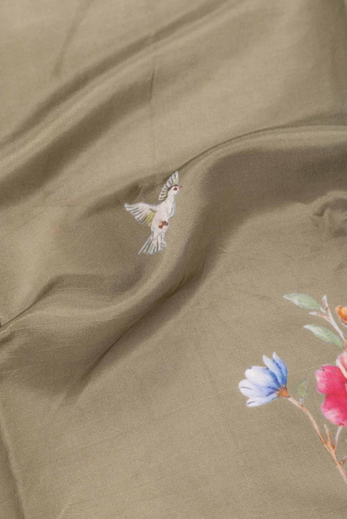 Close up of Mehandi Green Dual Tone Tussar Silk SareePrinted design on the body and Zari Border displaying folds