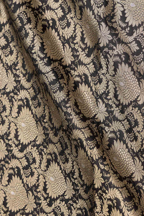 Close up of Black Dual Tone Banarasi Silk Saree with Zari Brocade on the body and Zari Border displaying folds