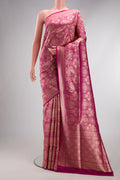 Magenta Banarasi Silk Saree with Zari Brocade on the body and Fancy Border.  displayed on a mannequin