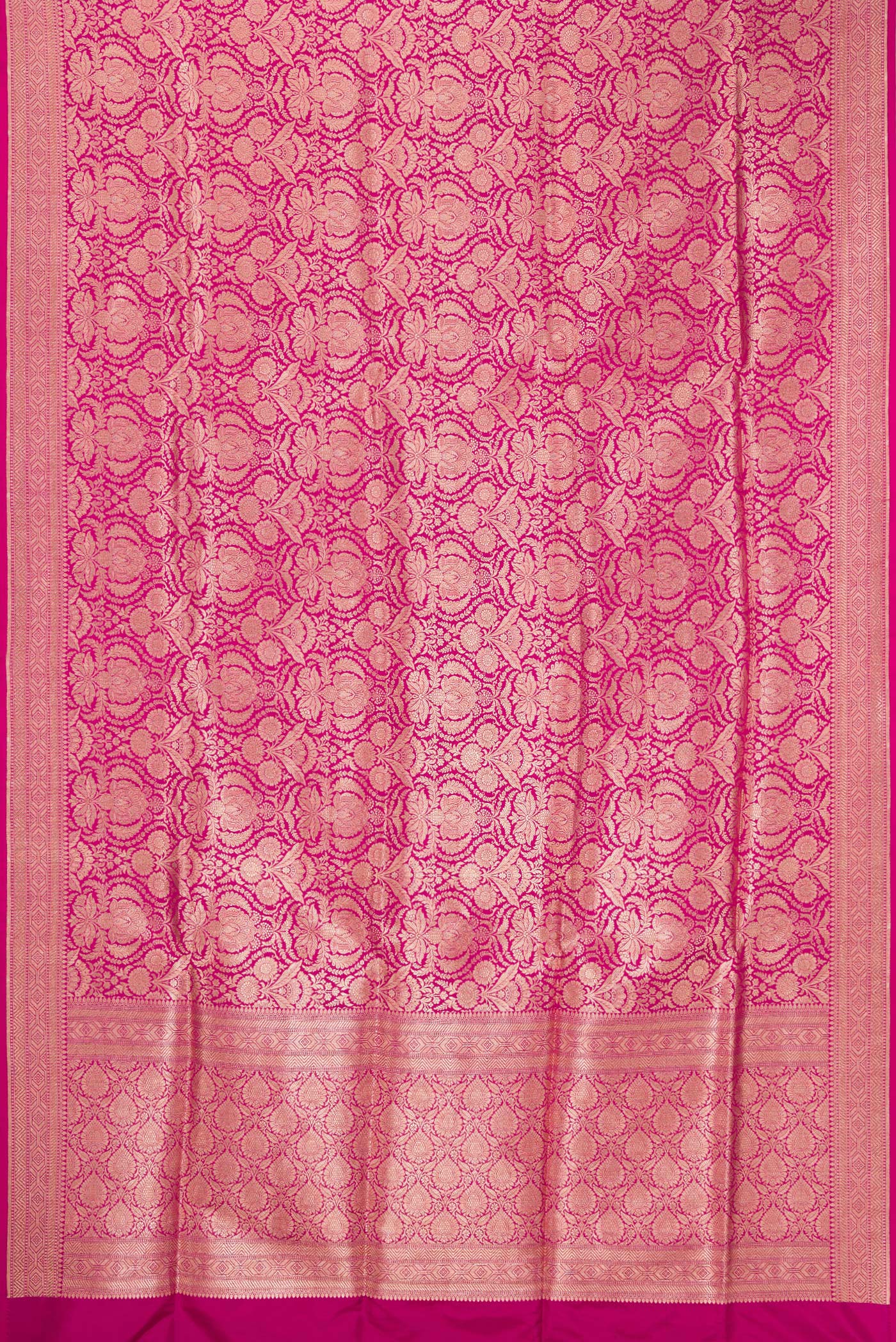 Flat view of Magenta Banarasi Silk Saree with Zari Brocade on the body and Fancy Border. 