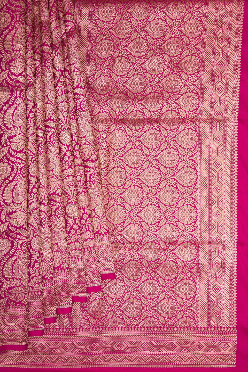 Pleats and pallu of Magenta Banarasi Silk Saree with Zari Brocade on the body and Fancy Border. 